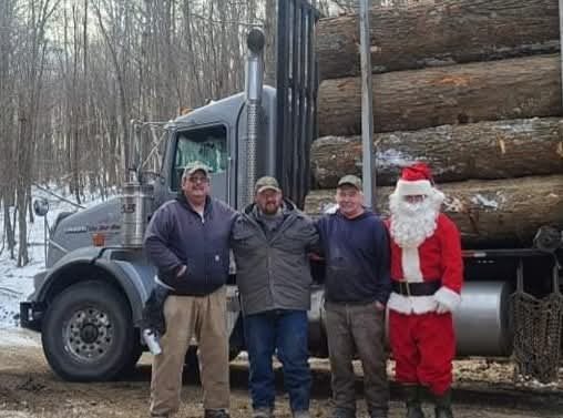 Santa Claus visiting the log yard with the crew